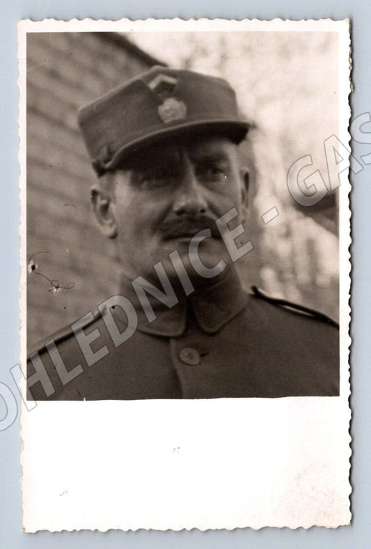 Postcard portrait of a soldier in black and white uniform (M3187)