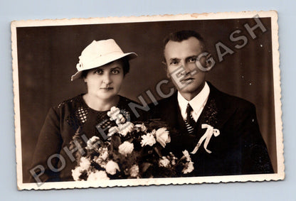 Pár s květinami ateliérová fotografie (M40622)
