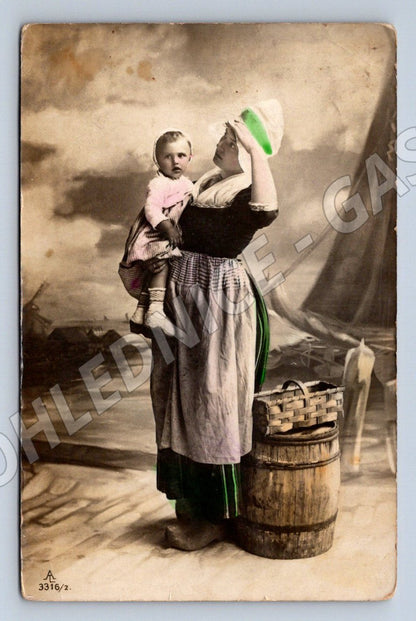 Postcard woman in traditional costume with child colored mail (ST3502)